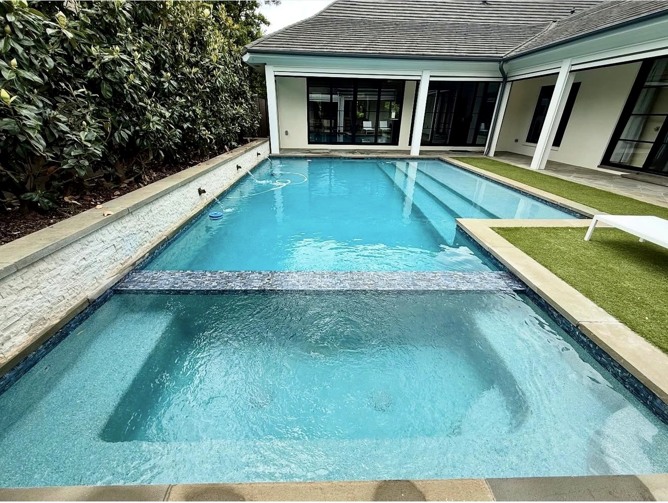 Finished pool and spa with clear blue water
