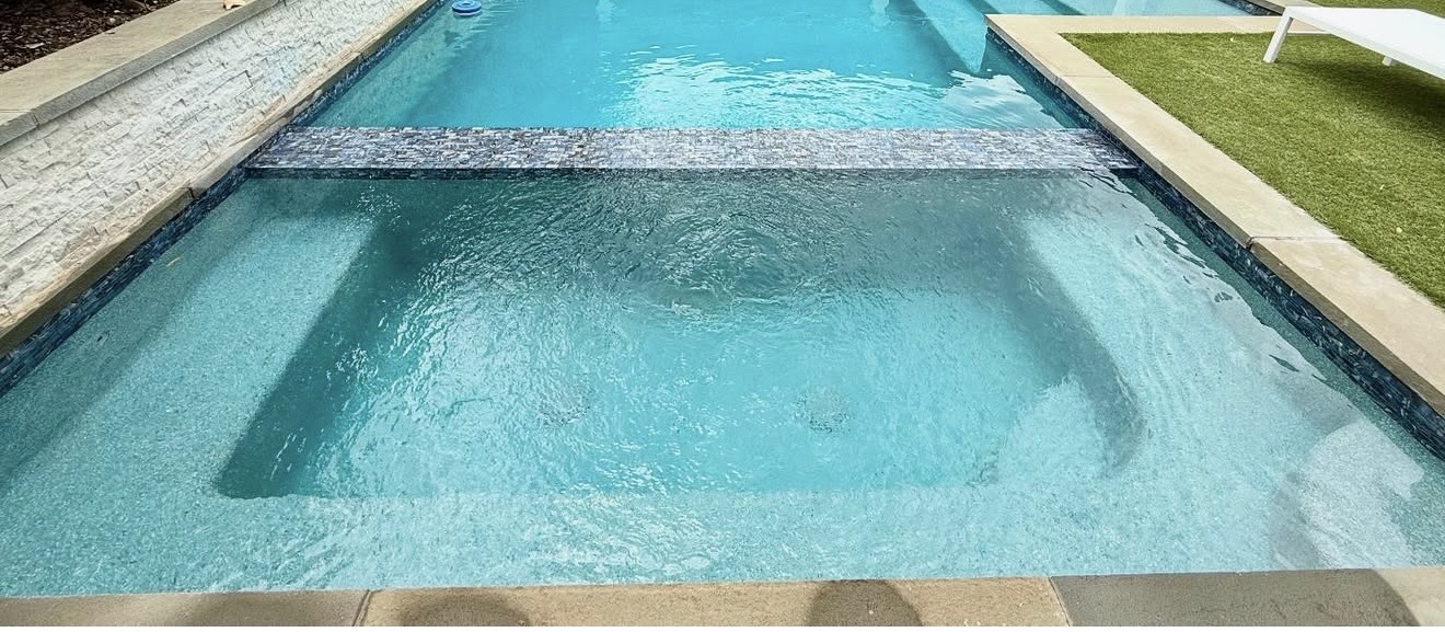 After construction: finished integrated spa with underwater seating and tiled divider