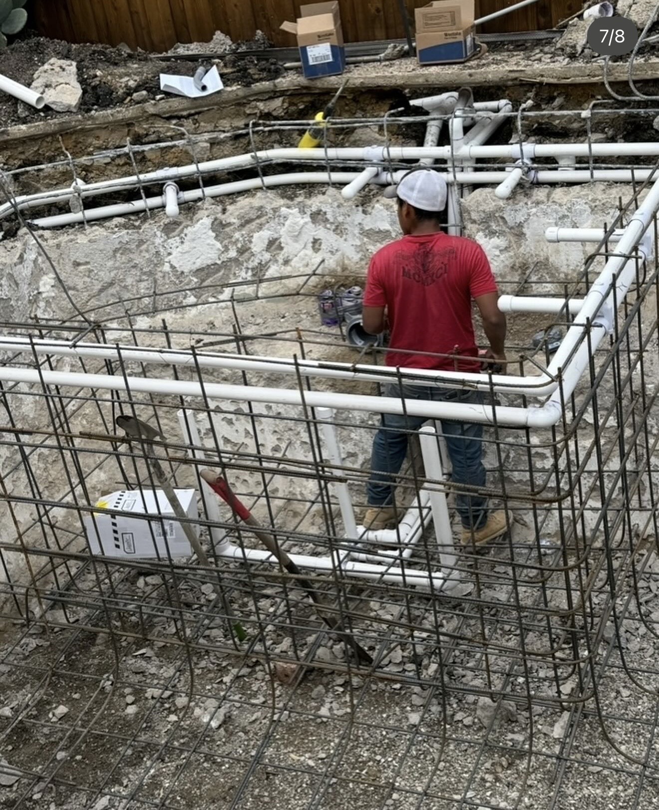 Before construction: excavated spa with reinforcing steel and PVC jet plumbing