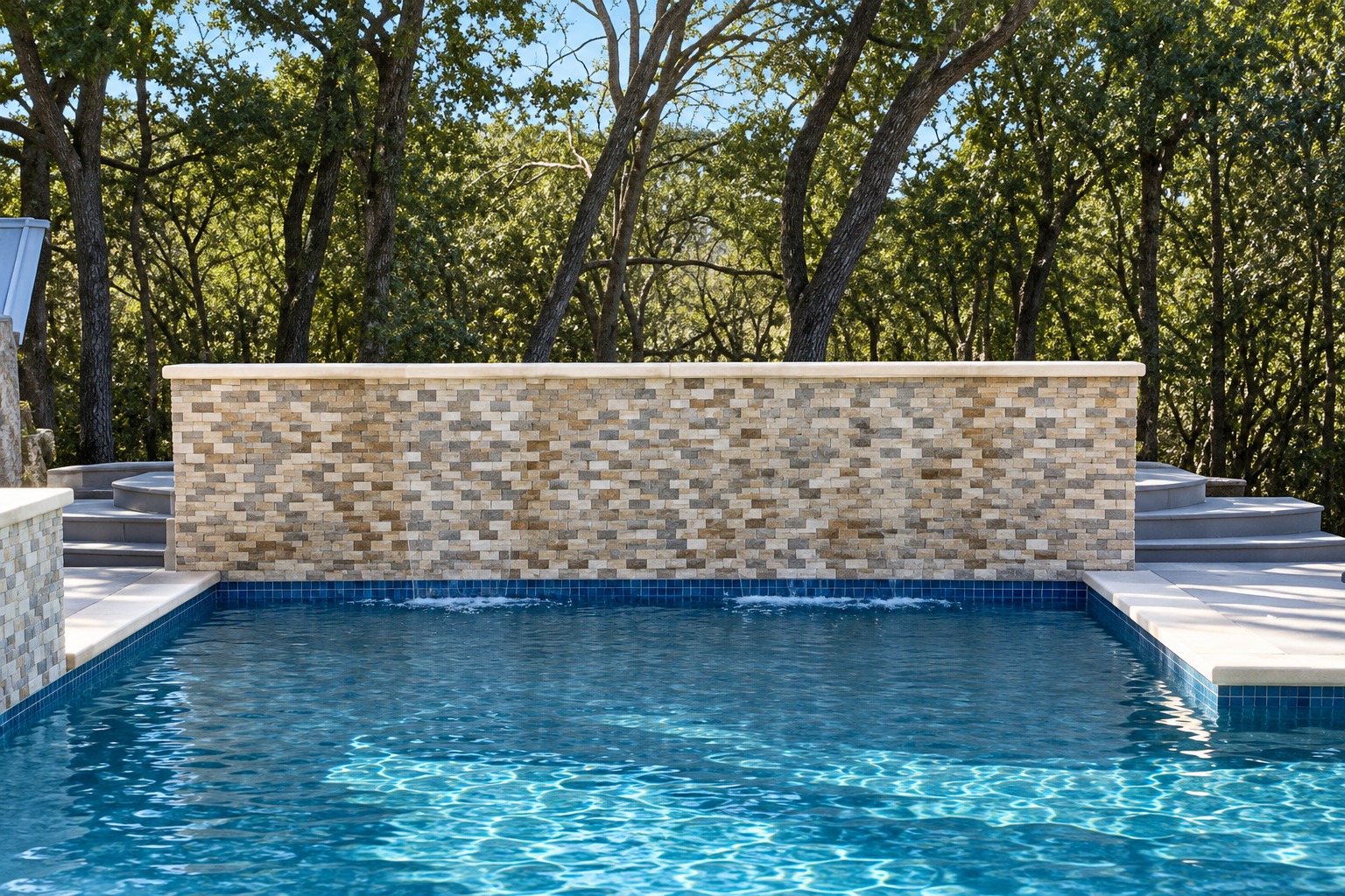 After renovation: stone-faced waterfall wall and restored filled pool